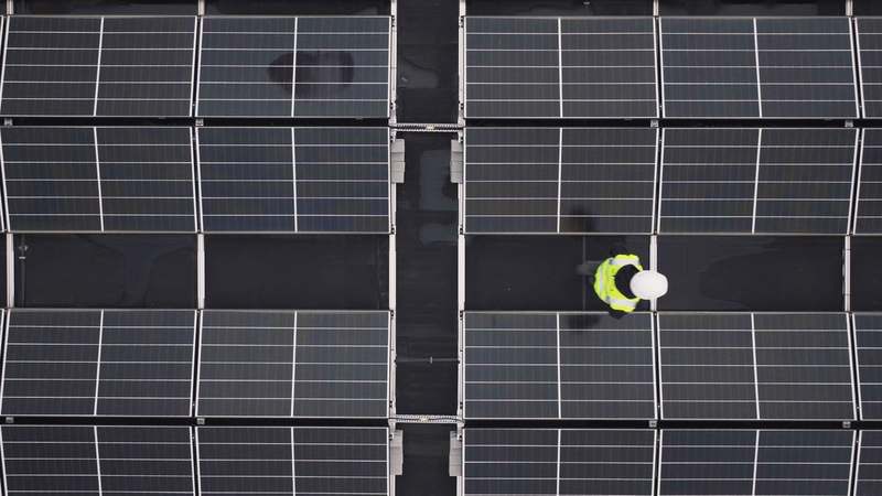 Close-up of neatly organized solar panel wiring with MC4 connectors on a rooftop array